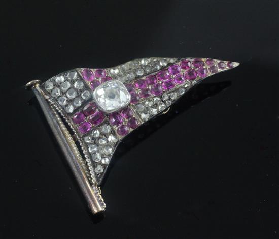 A late Victorian gold and silver, ruby and rose cut diamond set brooch modelled as a pennant, width 1.5in.